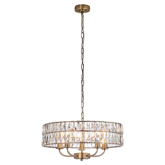 Bevmont 5 Light Pendant in antique brass with a drum-shaped frame of faceted crystal glass, suspended on an adjustable chain against a plain white background.