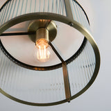 Rothbury Flush Ceiling Light in antique brass, close-up view showing the round brass ring frame, ribbed glass shade, and lit E27 bulb.