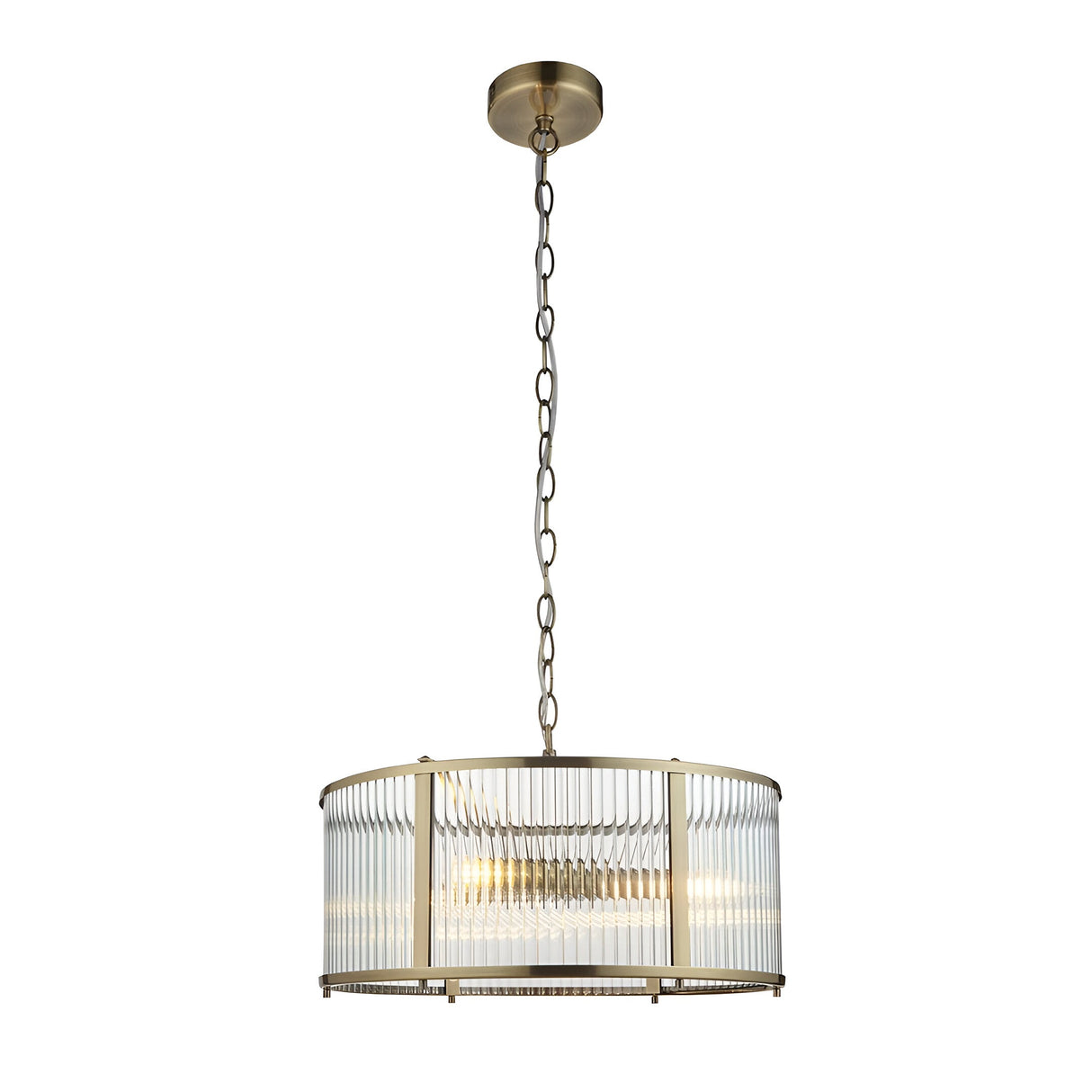 Rothbury 3 Light Pendant in antique brass with a drum frame and clear ribbed glass panels, hung from a chain on a plain white background.