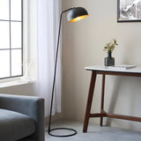 Endon Ashdon floor lamp in matt black with adjustable dome shade and brass-lined interior, beside a marble desk and grey sofa by a curtained window.