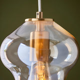 Close-up of the Brockley Pendant in Brass & Gold, showing a champagne lustre glass shade and satin brass fitting with visible E27 bulb holder.
