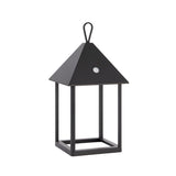Brenmont Medium Table Lamp in matt black, a bird-house style lantern with pyramid roof, top loop handle and open square frame.
