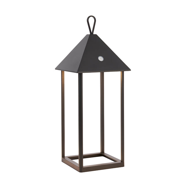 Endon Brenmont large table lamp in matt black, a modern bird-house lantern with pyramid roof, loop handle and open aluminium frame on a plain background.