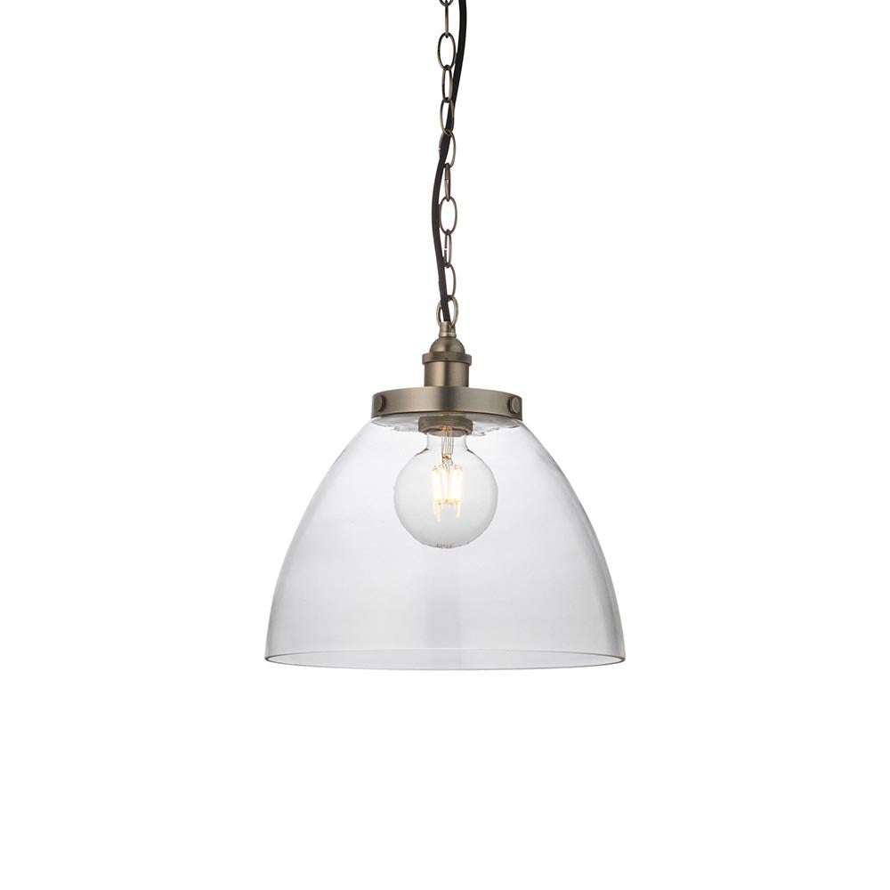 Wentworth Pendant in Silver, a single-light industrial fixture with a clear glass dome shade, brushed silver knurled lampholder, and black chain suspension.