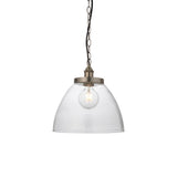 Wentworth Pendant in Silver, a single-light industrial fixture with a clear glass dome shade, brushed silver knurled lampholder, and black chain suspension.