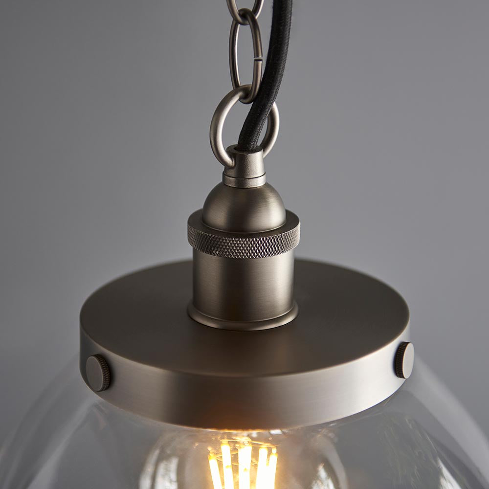 Close-up of the Wentworth Pendant in silver, showing the knurled E27 lampholder, chain link, and clear glass shade with visible filament bulb.