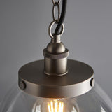 Close-up of the Wentworth Pendant in silver, showing the knurled E27 lampholder, chain link, and clear glass shade with visible filament bulb.