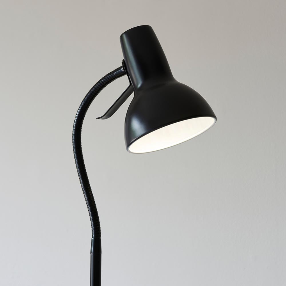 Endon Alderton floor lamp in matt black with an adjustable gooseneck stem, curved handle and bell-shaped GU10 head, shown against a light grey background.