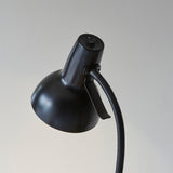 Endon Alderton floor lamp head in matt black, showing the adjustable dome shade, curved handle, rocker switch and flexible gooseneck stem on a light background.