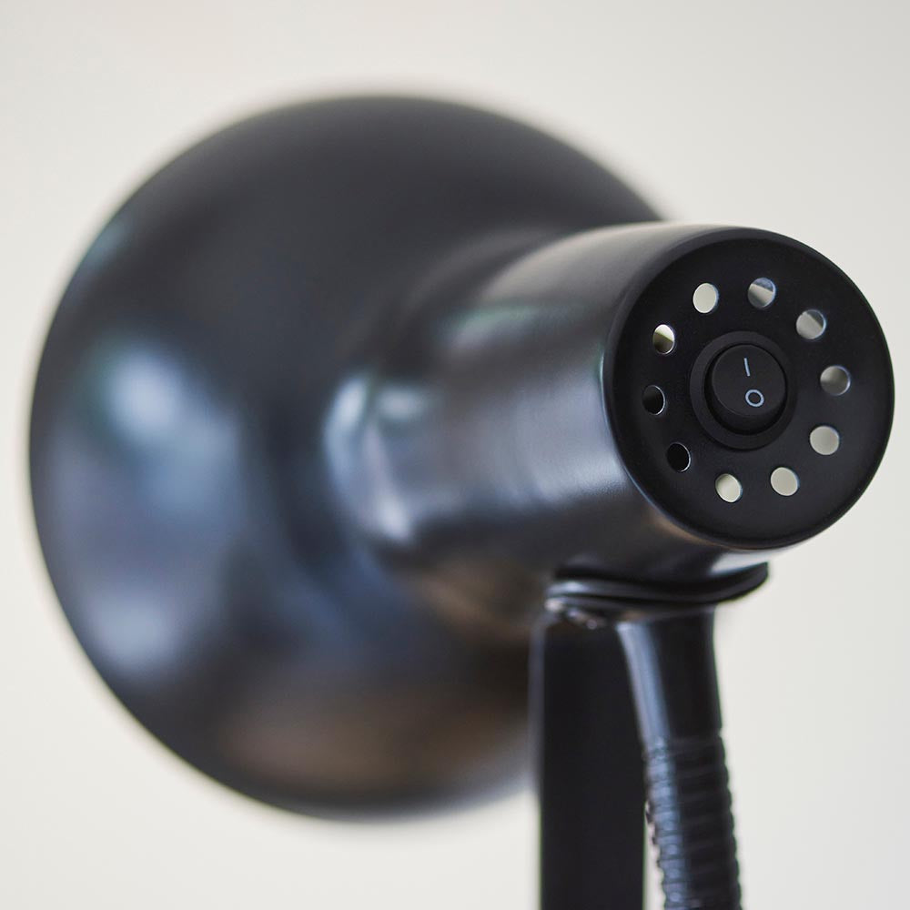 Close-up of the Endon Alderton Floor Lamp in matt black, showing the rocker switch and vented rear of the adjustable head above the flexible stem.