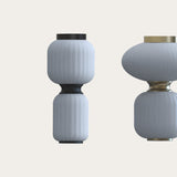 Whiteberry Echo LED flush ceiling light with two stacked ribbed white glass globes, matt black waist collar, canopy and base ring, shown against a plain light background.