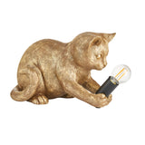 Endon Brockwick table lamp shaped as a gold resin kitten playing with a matt black E14 holder and filament bulb, on a plain white background.