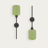 Greenberry Cylinder Ribbed Glass Wall Light shown in two mounting orientations, with a green ribbed glass cylinder shade, slim black iron rod and round backplate, on a plain light background.