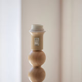 Close-up of the Endon Ashwood floor lamp showing the E27 lamp holder with on/off switch above a natural bamboo sphere.