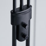 Close-up of the Endon Cliffcombe floor lamp showing the matt black stem with dual rotary dimmer switches for the uplighter and reading arm.