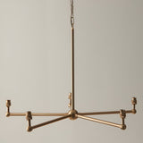 Cliffleigh 5-light pendant in brushed brass with five B22 holders on a star-shaped frame, hung from an adjustable chain.