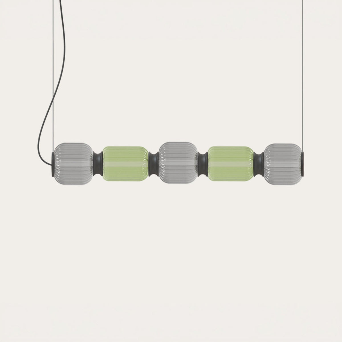 Greenberry LED 5 Light Linear Pendant with alternating grey and green ribbed glass shades and black collars, suspended on twin cables against a plain light background.