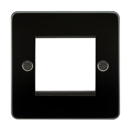 The 2 Gang Modular Faceplate in Gunmetal, made from premium-grade steel, features a central rectangular cutout for a switch or outlet and has two visible screw holes on each side, offering both durability and sleek aesthetics.