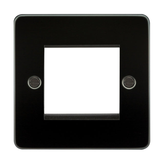 The 2 Gang Modular Faceplate in Gunmetal, made from premium-grade steel, features a central rectangular cutout for a switch or outlet and has two visible screw holes on each side, offering both durability and sleek aesthetics.