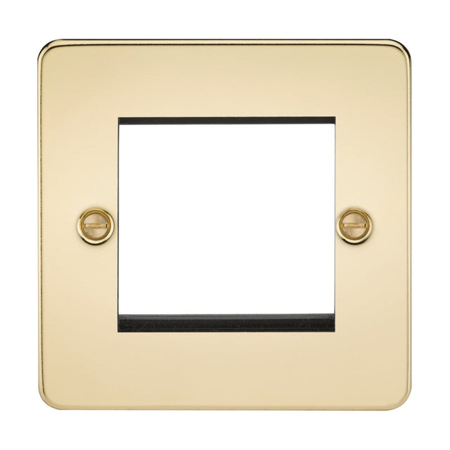 A 2 Gang Modular Faceplate in polished brass with a sleek and reflective finish, featuring a flat plate design. This gold-colored faceplate includes two screws and has a rectangular cutout for accommodating switches or outlets.