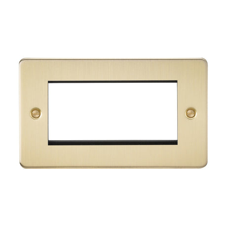 The 4 Gang Modular Faceplate in brushed brass is a rectangular outlet cover with a smooth finish and a flat plate low-profile design. It features a large central opening and two visible screw holes for mounting, making it ideal for TV/DATA/HDMI/USB installations. The background is plain white.