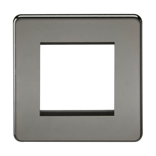 The 2 Gang Modular Faceplate - Black Nickel (Screwless) features a square, metallic design with a central cutout for switches or outlets. Its smooth edges and glossy finish in dark gray blend sleek elegance with modern functionality.
