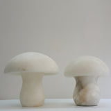 Two Morfia mushroom-form alabaster table lamps in soft white with natural veining, shown side by side on a plain light background.