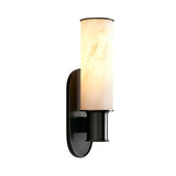 The Lumara 1 Light Tube Alabaster Wall Light in soft white and matte black features a white shade and brings an elegant, contemporary touch to any space.