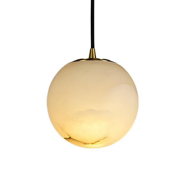 The Lyvane 1 Light Extra Small Globe Alabaster Single Pendant Light in soft white features a smooth, glossy alabaster shade with a black cord and gold cap for a modern touch.