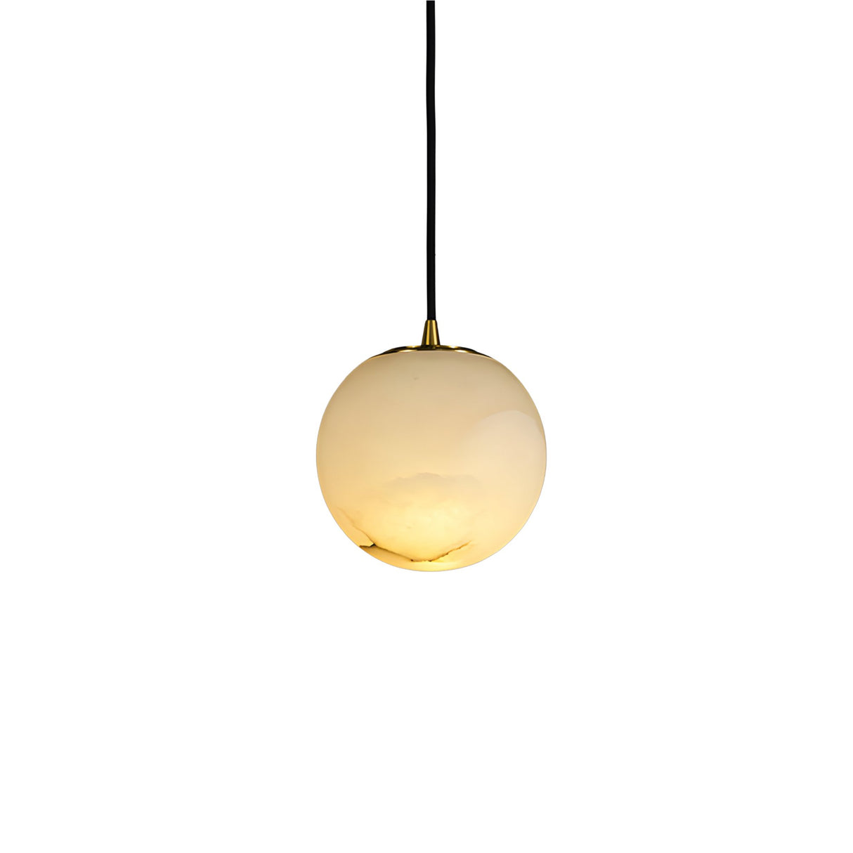 Niori Lyvane Extra Small Alabaster Globe Pendant Light in brushed brass with spherical Spanish alabaster shade on black cable, lit on white background.
