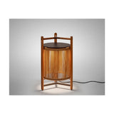 Kando P/76 outdoor floor lamp, lantern-style cylinder of sand nautical cord within a three-legged teak wood frame, dark round lid and top handle, lit, on a plain grey background.