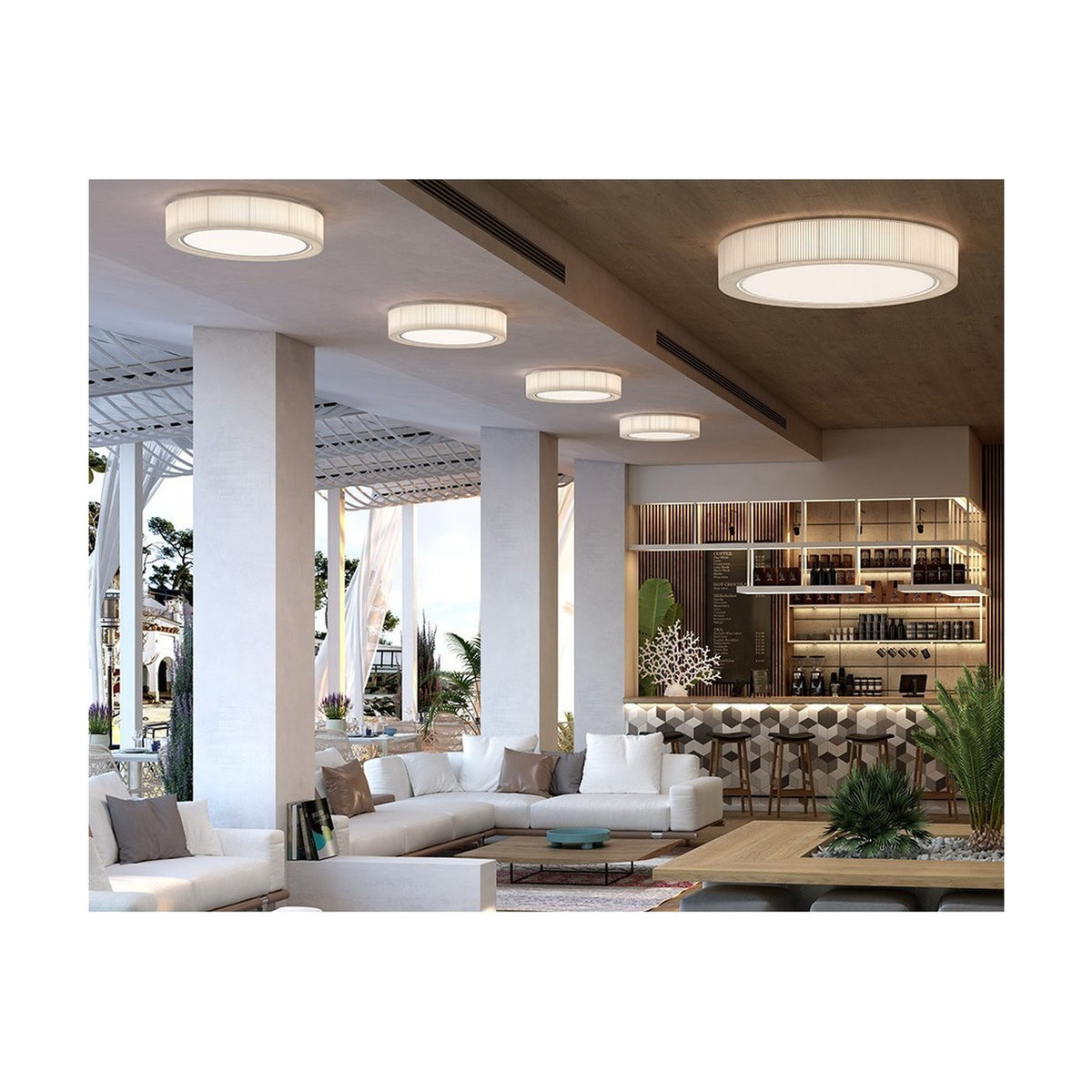 Urban PF/90 Ribbon LED ceiling lights with white pleated drum shades installed in a row along a hotel lounge ceiling above seating and a bar area.