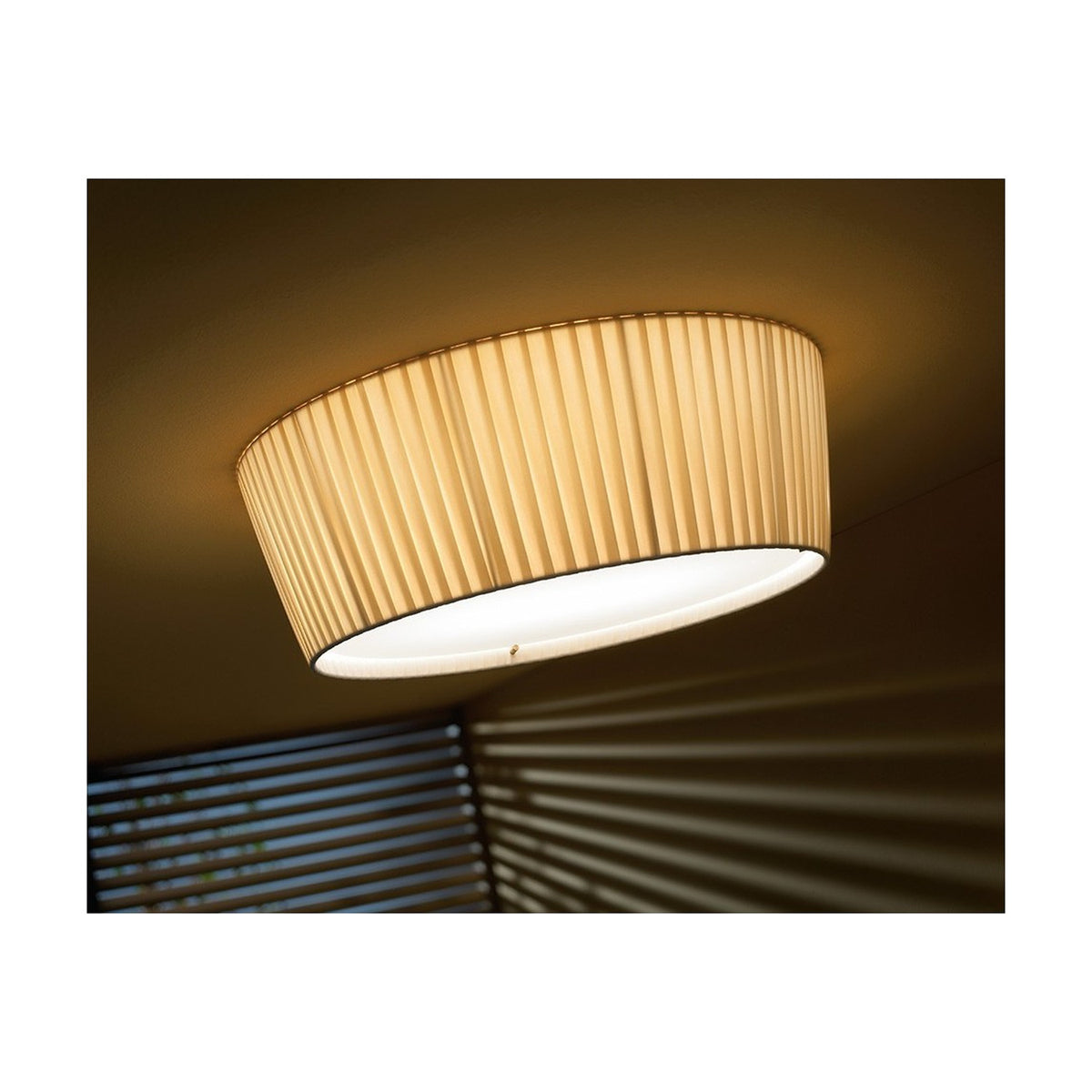 Plafonet 60 Ribbon LED ceiling light with pleated beige drum shade and white diffuser, mounted flush against a ceiling for soft ambient light.