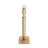 Endon Cranwick LED table lamp in brushed aged brass with a reeded stem, square base, touch dimmer button and integrated bulb, on a white background.