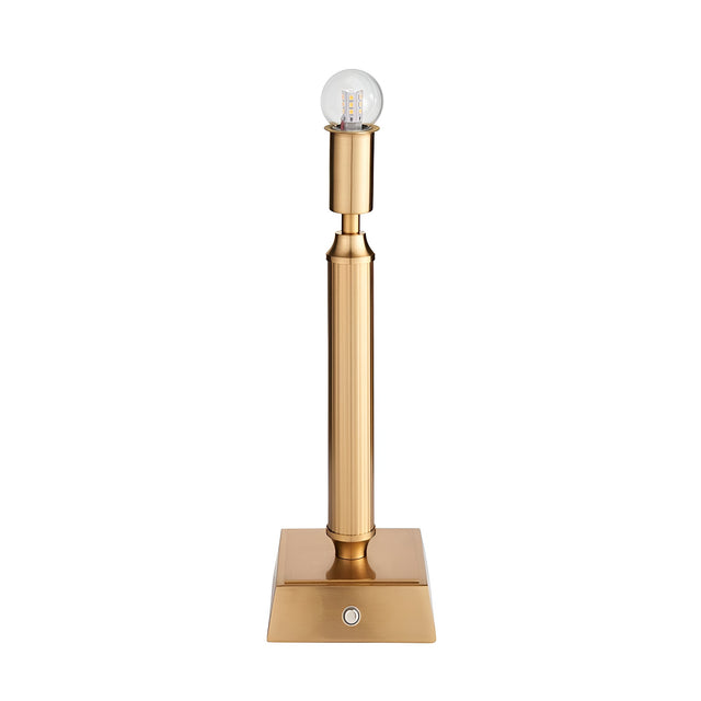 Endon Cranwick LED table lamp in brushed aged brass with a reeded stem, square base, touch dimmer button and integrated bulb, on a white background.