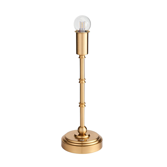 Endon Ashstead rechargeable LED table lamp base in brushed aged brass with a slim turned stem, round stepped base and clear globe bulb, on white.