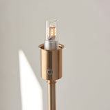 Close-up of the Endon Ashstead LED rechargeable floor lamp's aged brass holder with integrated LED bulb and touch dimmer button.