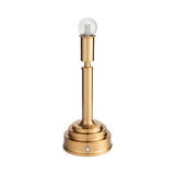 Danebourne LED Table Lamp in brushed brass with a stepped cylindrical base and exposed globe bulb, shown on a plain white background.
