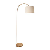 Endon Bevbourne arched floor lamp in brass finish with tilting natural fabric drum shade and round base, shown on a plain white background.