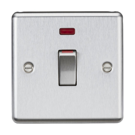 The "45A DP Switch Neon (1 Gang Size) - Brushed Chrome" is a stainless steel switch featuring a red indicator light above the toggle. Its brushed chrome finish enhances the aesthetic, complemented by two visible screws on either side. Perfect for integration with cooker control units, this double pole switch offers both functionality and style.