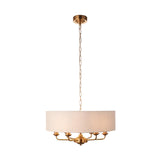 Endon Brenley 6 light pendant in vintage brass with a large round natural linen drum shade and chain suspension, shown on a white background.