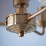 Close-up of the Brenley 3 Light Pendant in vintage brass, showing tiered metal detailing, arms and a rounded finial against a plain light background.