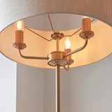 Close-up of the Endon Brenley 3 Light Floor Lamp in brass, showing three E14 candle bulbs on curved arms beneath a wide natural linen shade.