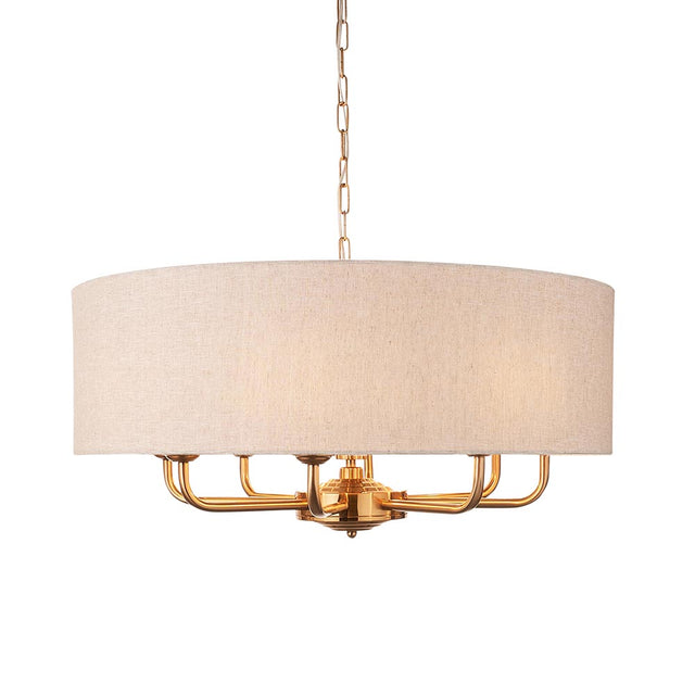 Endon Brenley pendant light with a wide natural linen drum shade and vintage brass arms holding eight E14 lamp holders, shown on a white background.
