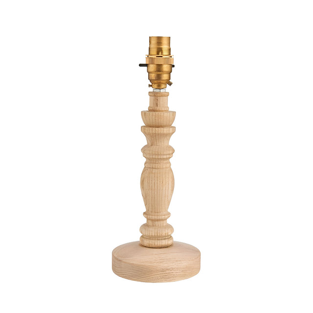 Endon Aldworth turned spindle table lamp in natural ash wood with a brass B22 switched lampholder, shown without a shade on a plain white background.