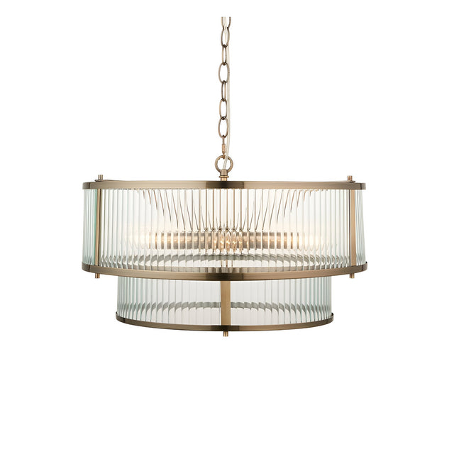 Endon Rothbury 5 light pendant in antique brass with two tiers of clear ribbed glass panel shades, suspended from a chain on a white background.