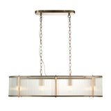 Rothbury 4-light linear pendant in antique brass with clear ribbed glass shades, hung by twin chains from a rectangular ceiling plate.