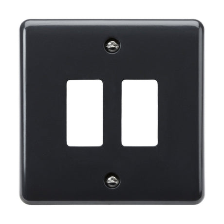 The 2 Gang Grid Faceplate [Part M Compliant] is a sleek, black double light switch cover plate featuring anti-microbial protection. It has two rectangular openings and visible screws, with a smooth, glossy surface that ensures both style and hygiene.
