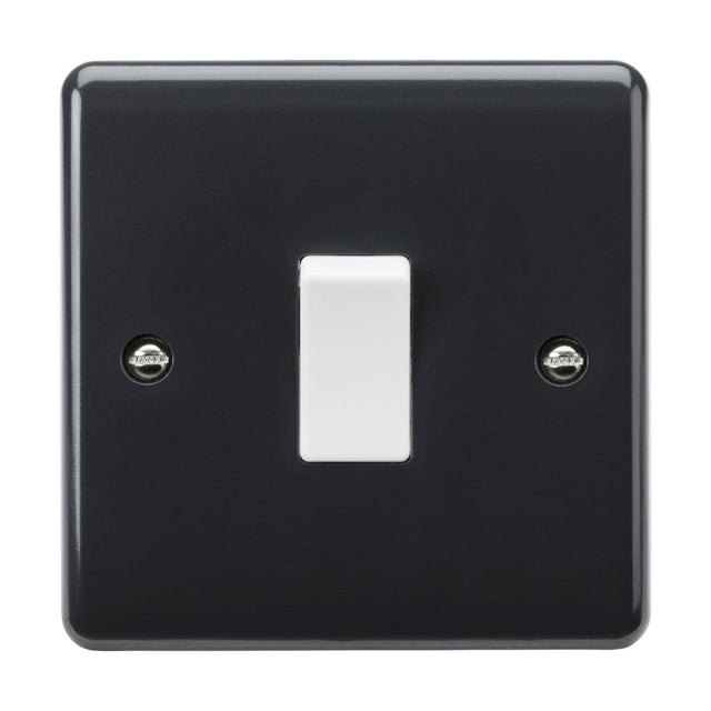 The 10AX 1 Gang 2-Way Switch [Part M Compliant] from the Curved Edge range is a black light switch plate that includes a centered white toggle switch. This simple, functional design features two visible screws on either side and boasts anti-microbial properties for enhanced safety and hygiene.