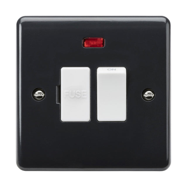 The black electrical switch panel is equipped with two white switches from the Curved Edge range, one labeled FUSE and the other ON. A red indicator light above these ensures compliance with Building Regulations Part M, and there are two screws visible on the sides. This setup features the 13A Switched Fused Spur Neon And Flex Outlet from Base [Part M Compliant].